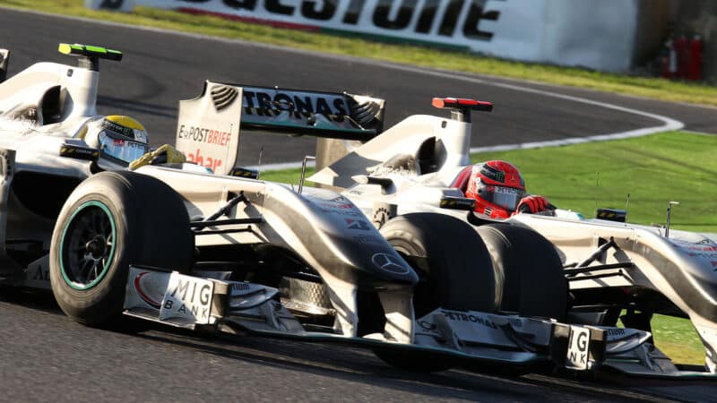 Nico Rosberg battles Mercedes team mate Michael Schumacher in the 2010 Japanese Grand Prix