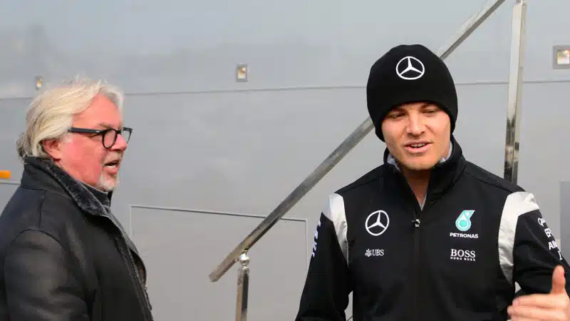 Nico Rosberg talks to his father Keke in the Formula 1 paddock