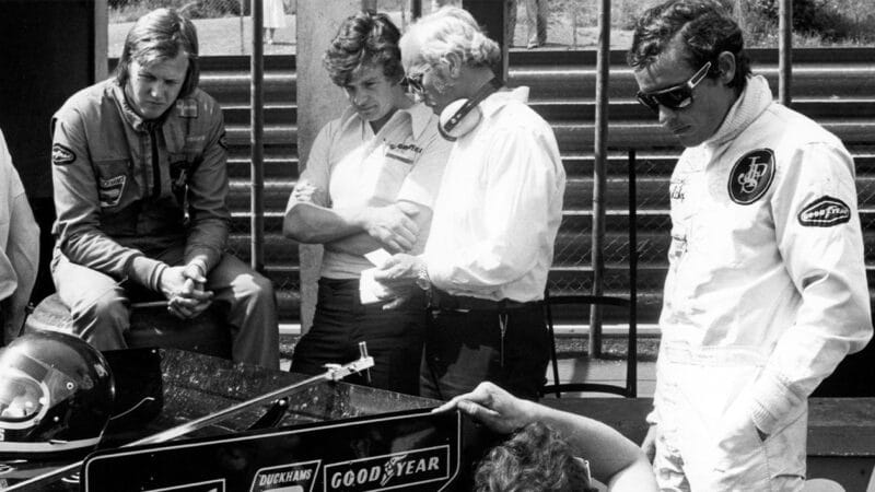 Ronnie Peterson with Colin Chapman and Jacky Ickx in 1974