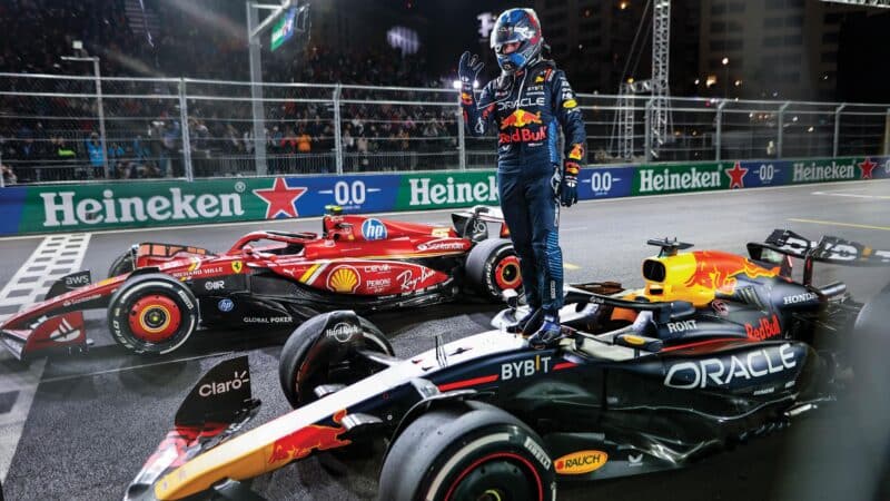 Vegas, Max Verstappen stands on car holding up four