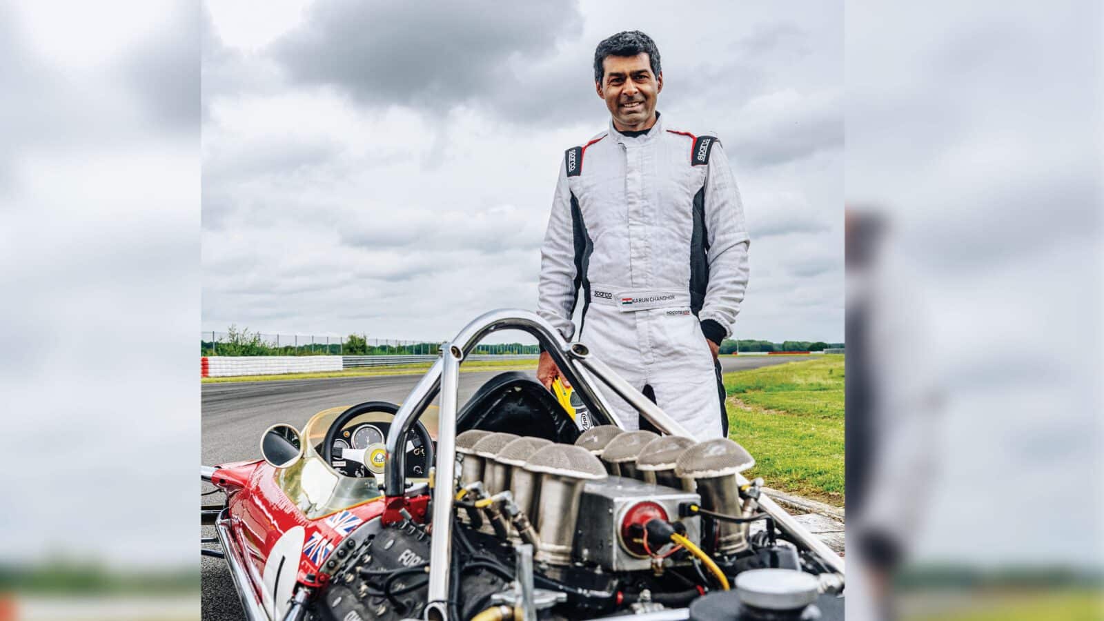 karun chandhok stands with car