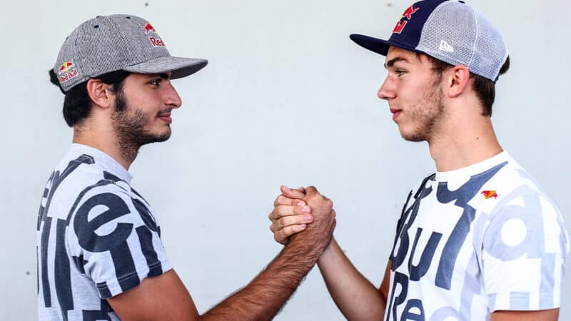 Carlos Sainz and Pierre Gasly shake hands in 2014