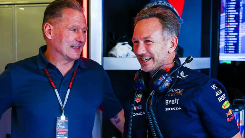 Jos Verstappen and Christian Horner in Red Bull F1 pit garage