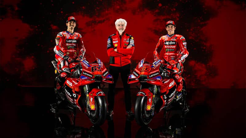 Pecco Bagnaia and Marc Marquez with Gigi Dall Igna in Ducati studio picture