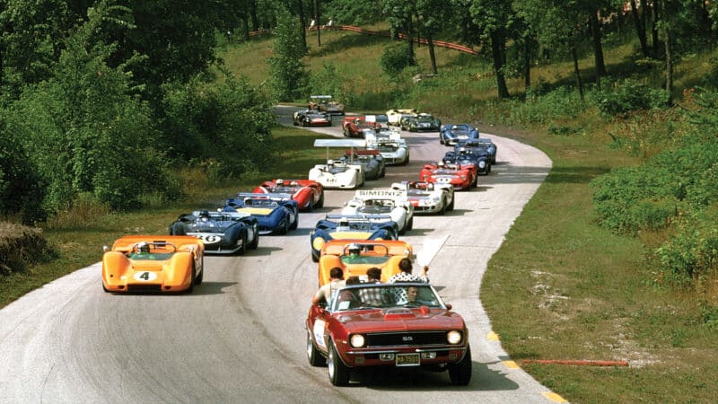 pace car driven by Stirling Moss heads Road America Can-Am field, 1967