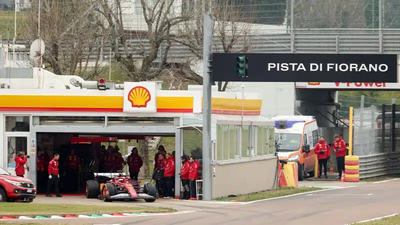 Charles Leclerc leaves pit garage at Fiorano for shakedown of 2025 Ferrari F1 car