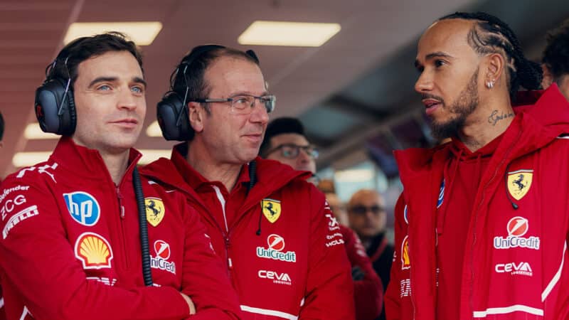 Lewis Hamilton with Ferrari pit crew