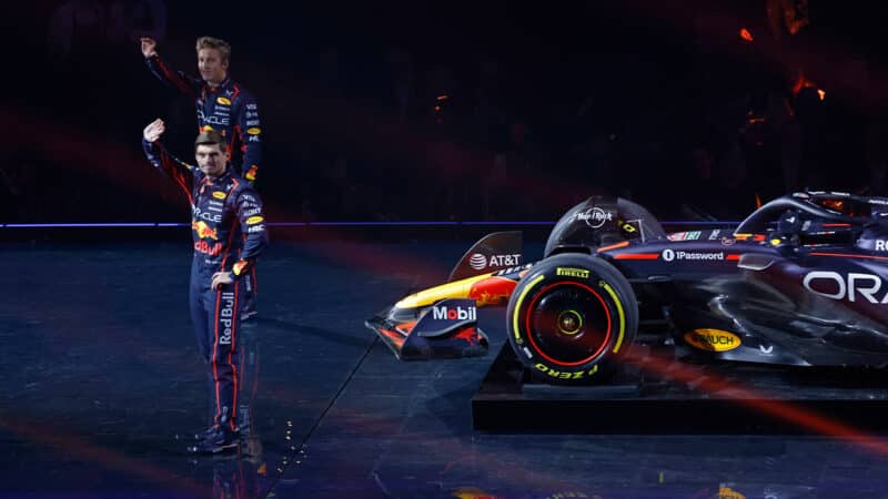 Liam Lawson and Max Verstappen wave to the crowd at F1 75 Live event