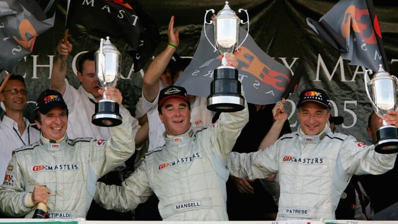 Nigel Mansell on GP Masters podium at Kyalami with Emerson Fittipaldi and Riccardo Patrese