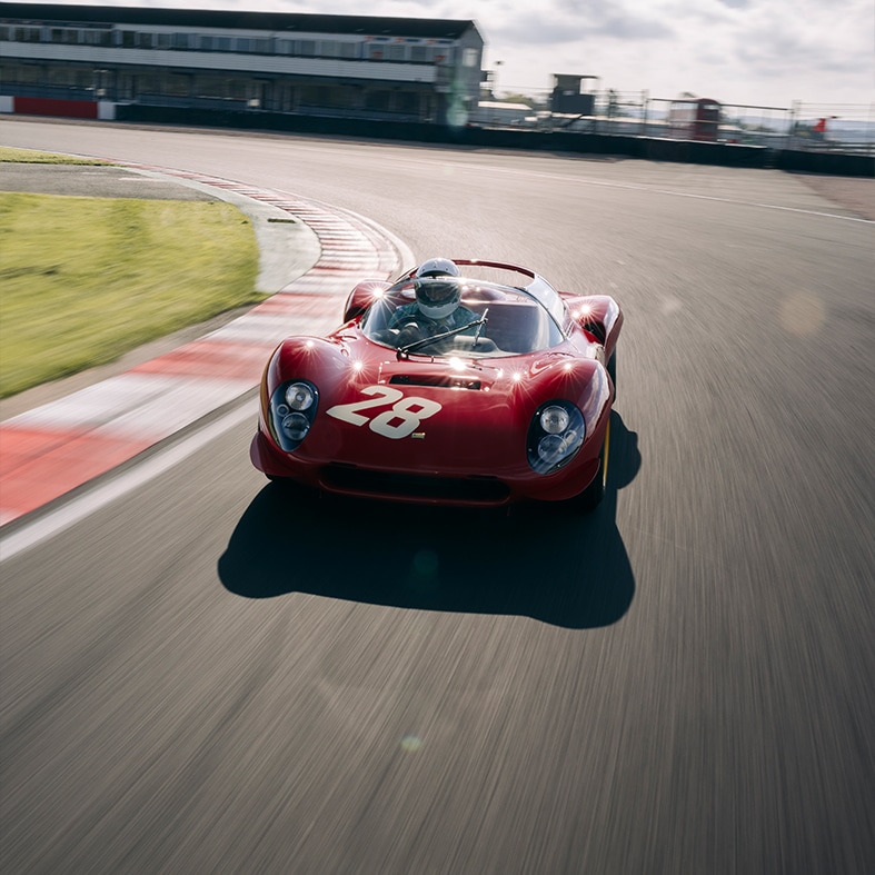 Overhead front image of Ferrari Dino 206S on track