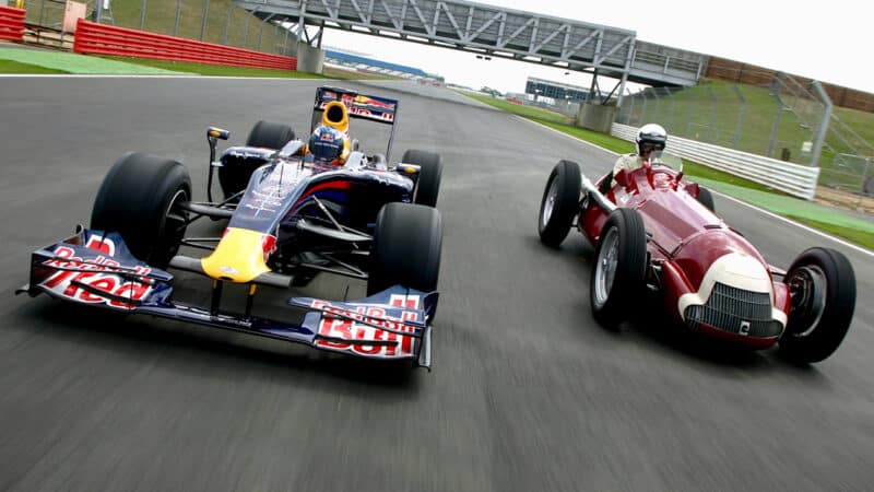 Red Bull and Alfa Romeo 158 F1 cars on track at Silverstone