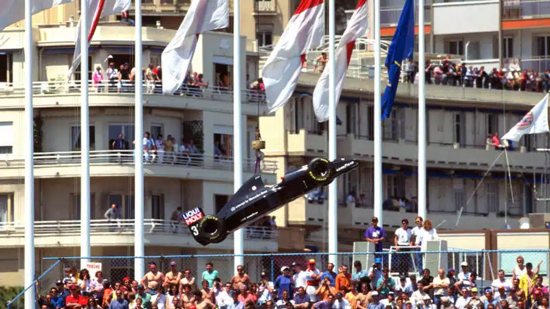 Sauber F1 car is lifted above the crowd at 1993 F1 Monaco Grand Prix