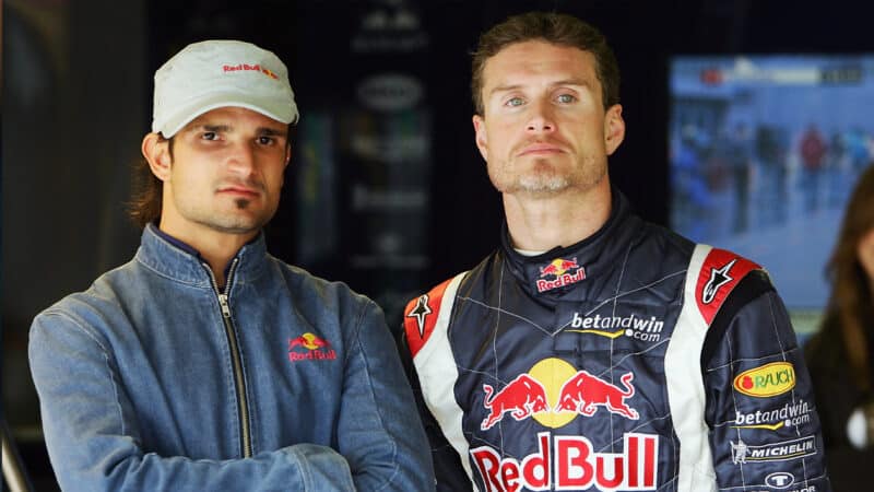 2005 Red Bull team mates Vitantonio Liuzzi and David Coulthard pose for a photo