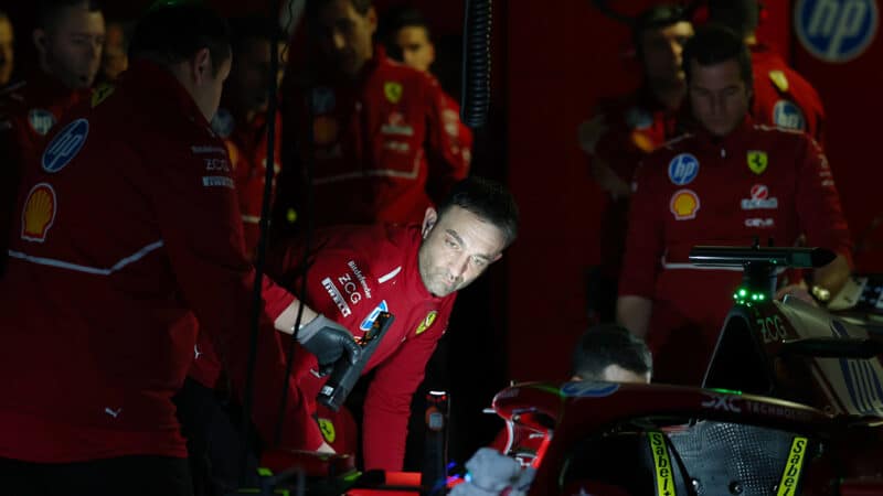 Ferrari F1 pit crew use torch to work on car during power cut at 2025 preseason testing