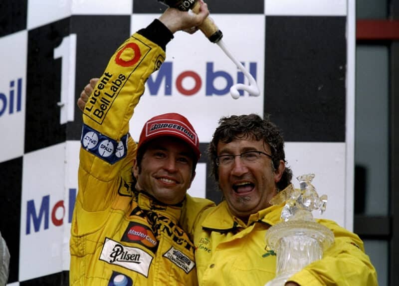 Heinz-Harald Frentzen pours champagne over Eddie Jordan after victory in the 1999 French Grand Prix