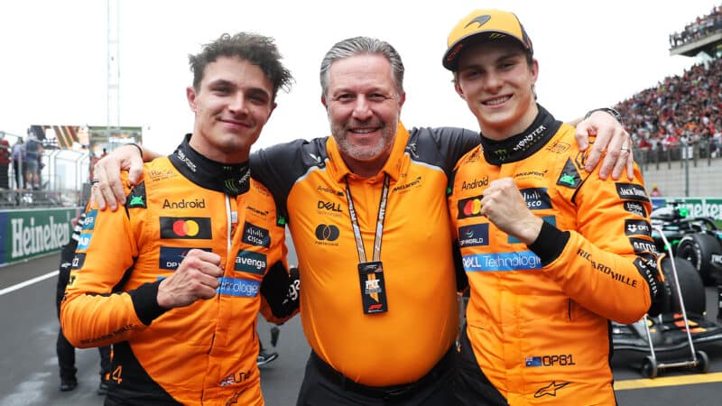 Lando Norris with Zak Brown and Oscar Piastri after the 2025 F1 Chinese Grand Prix