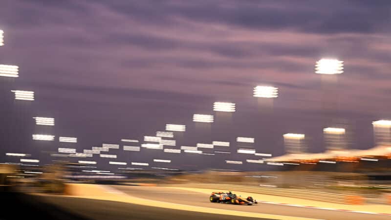 McLaren of Lando Norris under floodlights at 2025 F1 Bahrain preseason testing