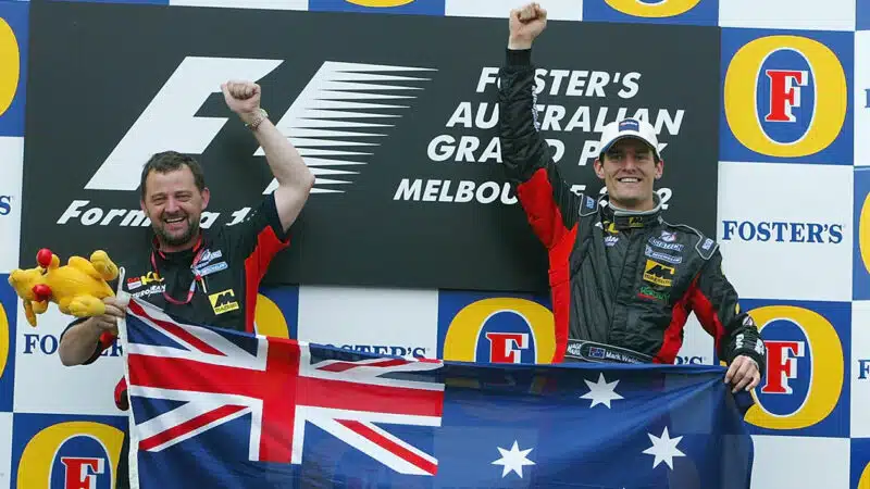 Paul Stoddart of Minardi and Mark Webber on Melbourne podium after finishing fifth in the 2002 Australian Grand Prix