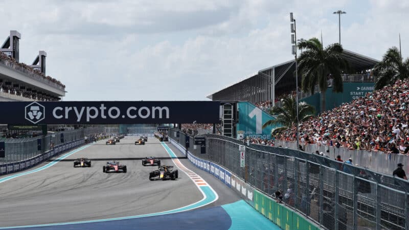 Max Verstappen (Red Bull-Honda) leads the field in front of full grandstands on the parade lap before the 2024 Miami Grand Prix
