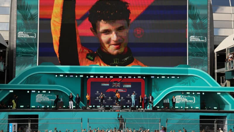 Lando Norris, Andrea Stella (both McLaren-Mercedes) , Max Verstappen (Red Bull-Honda) and Charles Leclerc (Ferrari) on the podium after the 2024 Miami Grand Prix