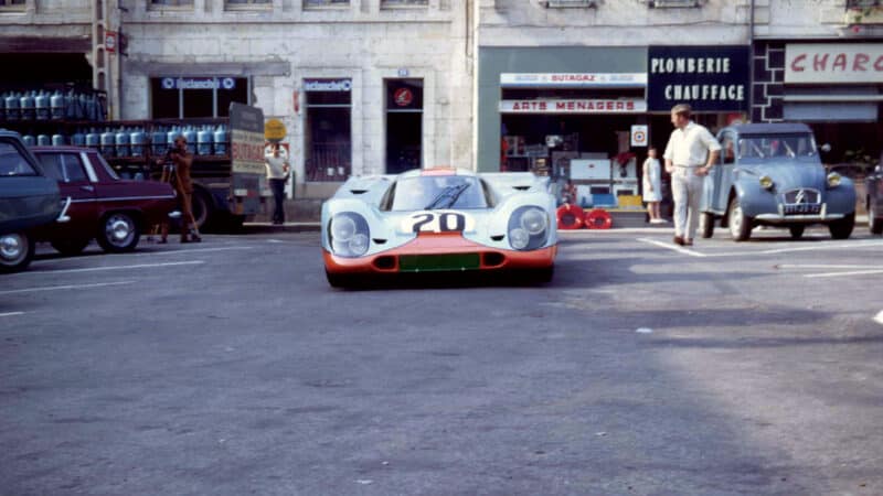 the sight of a Porsche 917 on a public street with a 2CV, standard...