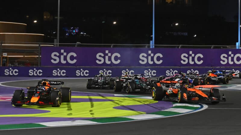 Oscar Piastri and Max Verstappen fight it out at the start of the Saudi Arabian GP