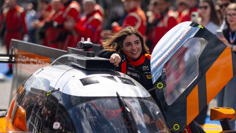 Jamie Chadwick leans out of her LMP2 car door after victory in 2025 ELMS Barcelona round door