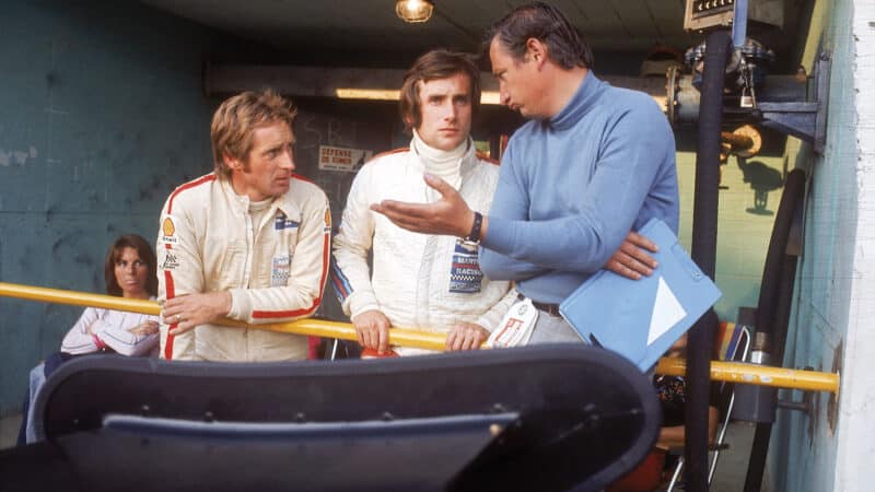 Norbert Singer at Le Mans in 1974 offers advice to Helmuth Koinigg