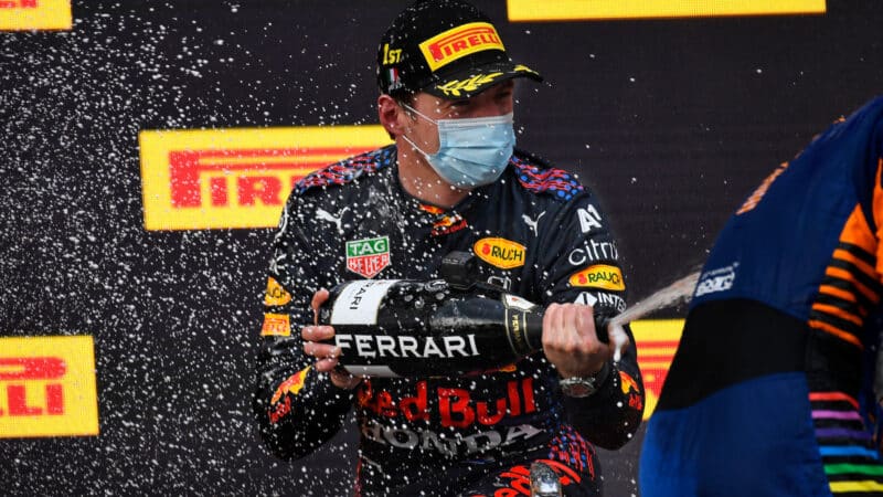 Lando Norris (McLaren-Mercedes) and Max Verstappen (Red Bull-Honda) on the podium after the 2021 Emilia Romagna Grand Prix