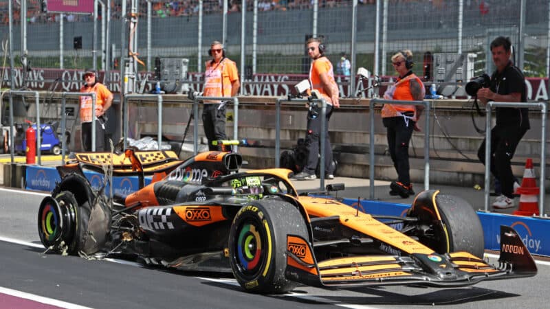 Lando Norris (McLaren-Mercedes) in the pits with a damaged tyre during the 2024 Austrian Grand Prix
