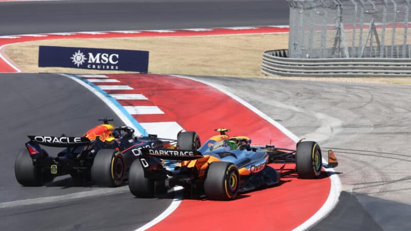 Max Verstappen (Red Bull-Honda) and Lando Norris (McLaren-Mercedes) in the first corner after the start of the 2024 United States Grand Prix
