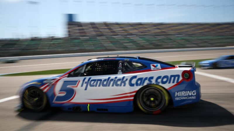 Kyle Larson, driver of the #5 HendrickCars.com Chevrolet, exits pit road during the NASCAR Cup Series AdventHealth 400 at Kansas Speedway