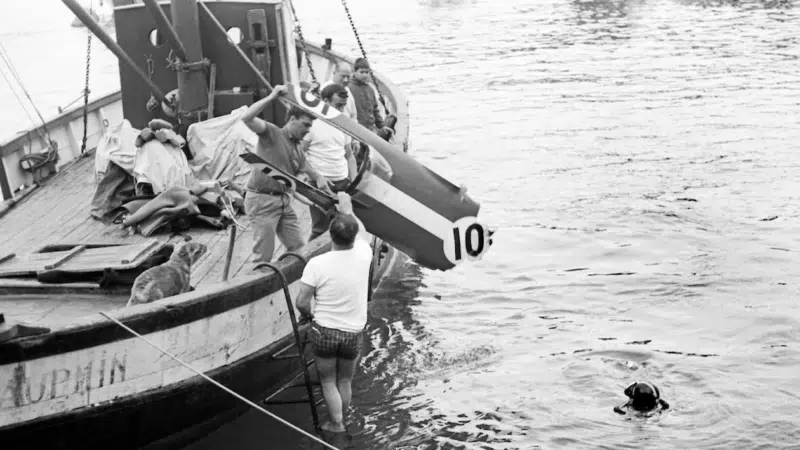 The Lotus of Paul Hawkins is retrieved from the harbour in 1965