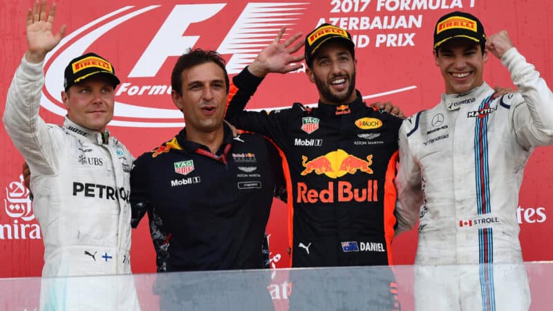 Daniel Ricciardo (Red Bull-Renault), Valtteri Bottas (Mercedes) and Lance Stroll (Williams-Mercedes) on the podium with Red Bull engineer after the 2017 Azerbaijan Grand Prix