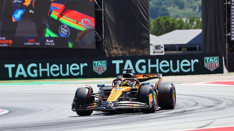 Oscar Piastri (McLaren-Mercedes) in front of giant TV screen during practice for the 2025 Spanish Grand Prix