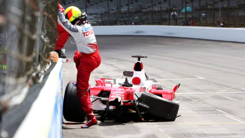 Ralf Schumacher (GER) walks away from his Toyota TF105 after crashing at the final corner.