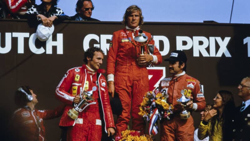 James Hunt celebrates victory on the podium with Niki Lauda, 2nd position and Clay Regazzoni, 3rd position during the Dutch GP