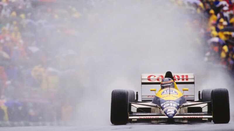 Thierry Boutsen throws up a cloud of spray behind his Williams F1 car as he drives to victory in the 1989 F1 Canadian Grand Prix
