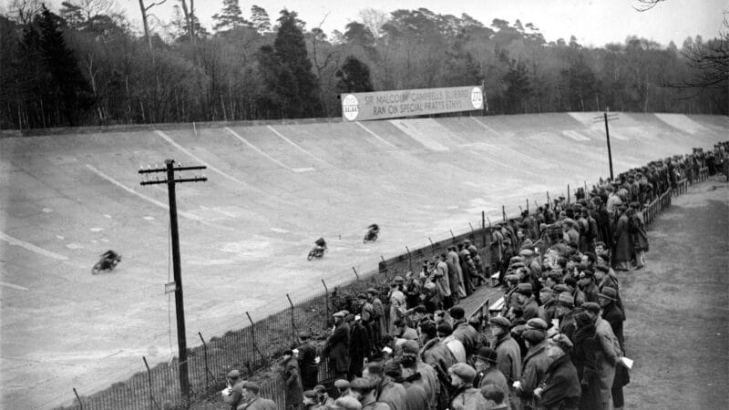Motorcycles race around the banking at Brooklands