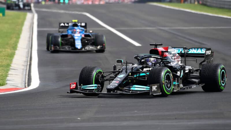 Lewis Hamilton (Mercedes leads Esteban Ocon (Alpine-Renault) in the 2021 Hungarian Grand Prix