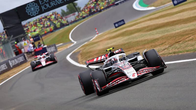 Haas-Ferrari drivers Oliver Bearman and Esteban Ocon enter the pits during practice for the 2025 British Grand Prix
