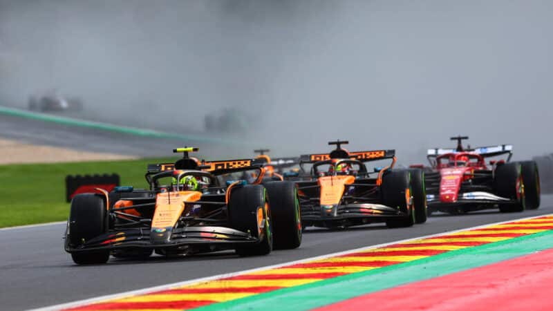 Lando Norris leads at the start of the Belgian GP