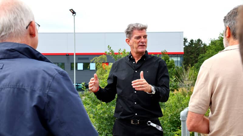Graeme Lowdon speaks to journalists outside Cadillac F1 team building