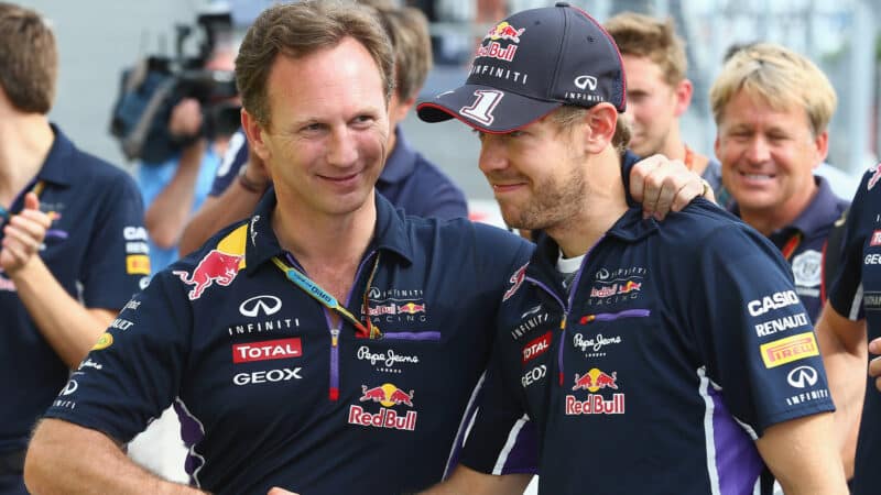 Max Verstappen shakes hands with Sebastian Vettel in 2014