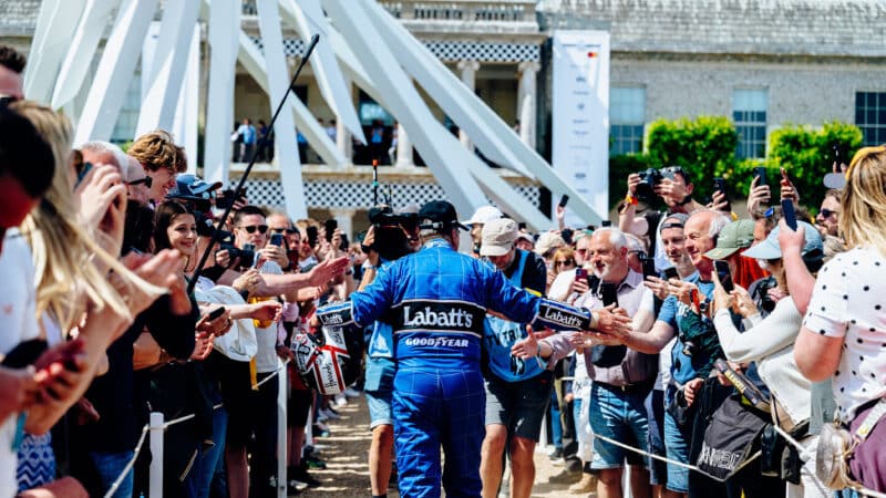 Nigel Mansell walks through crowds at the 2022 Goodwood Festival of Speed