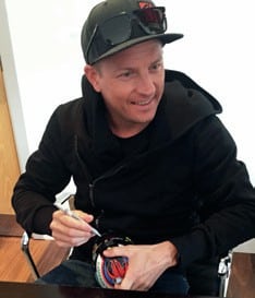 Kimi Raikkonen signing a model helmet