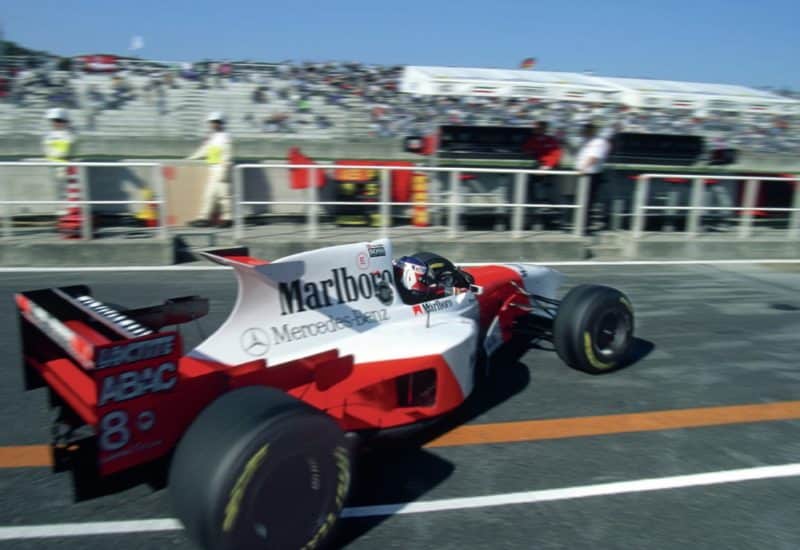 McLaren of Jan Magnussen pulls out of the pits in 1995