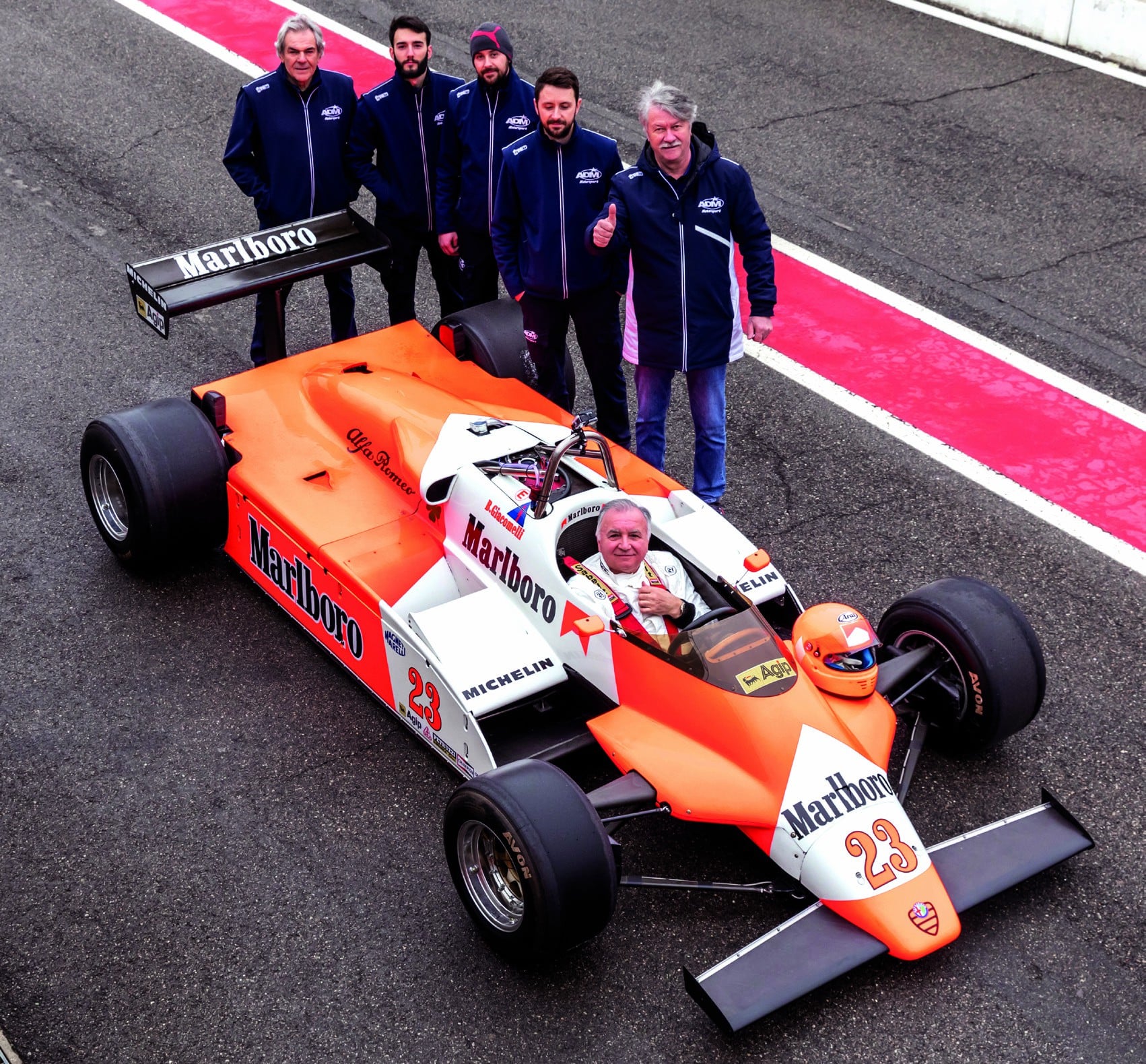 Alfa Romeo of Bruno Giacomelli with ADM restorers